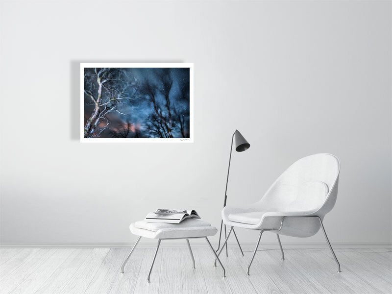 Winter storm long exposure photo of swaying trees, white wall in living room.