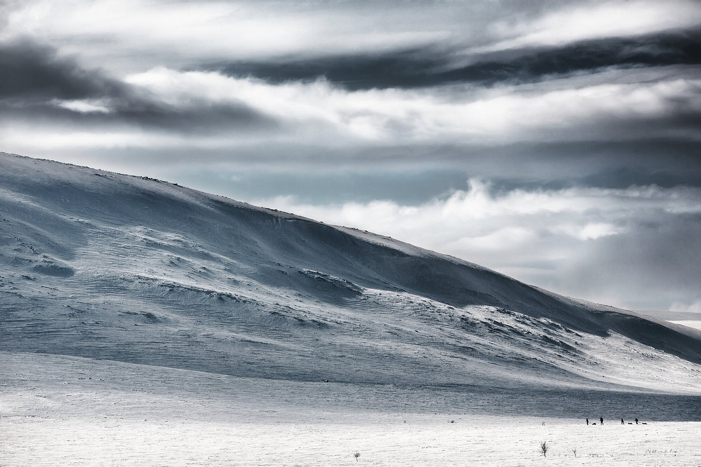 Ski hikers exploring the Arctic wilderness in spring winter.