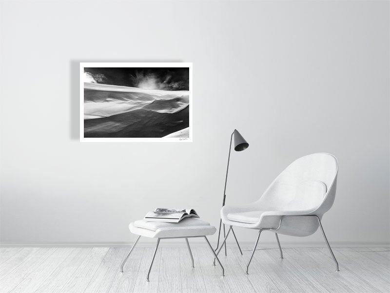 Black and white photo of wind-sculpted snowy ravine wall in Arctic wilderness, white living room wall.