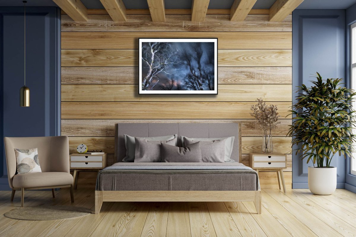 Framed winter storm long exposure photo of swaying trees, wooden wall in bedroom.