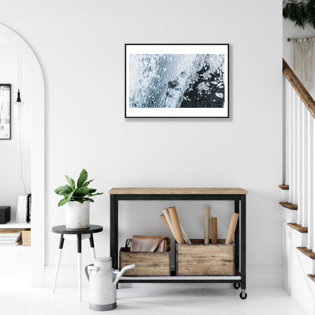 Framed aerial photo of cracked Norwegian sea ice, broken fragments, visible seabed, white living room wall