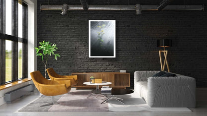 Framed water crowfoot blooms photo, black brick wall above cabinet in modern living room.