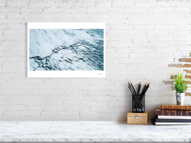 Norway frozen ocean aerial photo print, cracked ice graphic pattern, white living room wall.