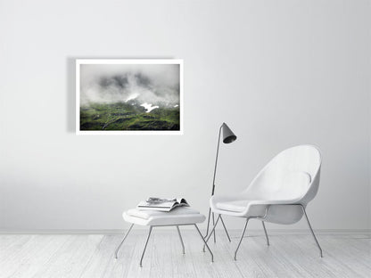 Photo of cloud-covered Norwegian peak with meltwater streams, snowy patches, white living room wall.