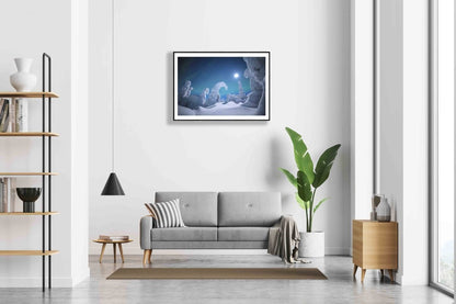 Moonlit auroras over snowy trees print, black-framed on white wall above sofa.