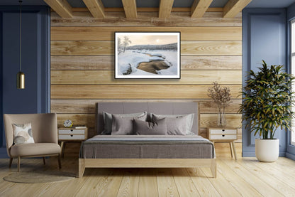 Fine art print of Arctic river, bronze sunlight reflection, on wooden wall above bed.