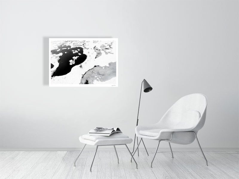 Aerial black and white bog photo print, contrasting frozen and thawed ponds, five stunted spruces, white living room wall.