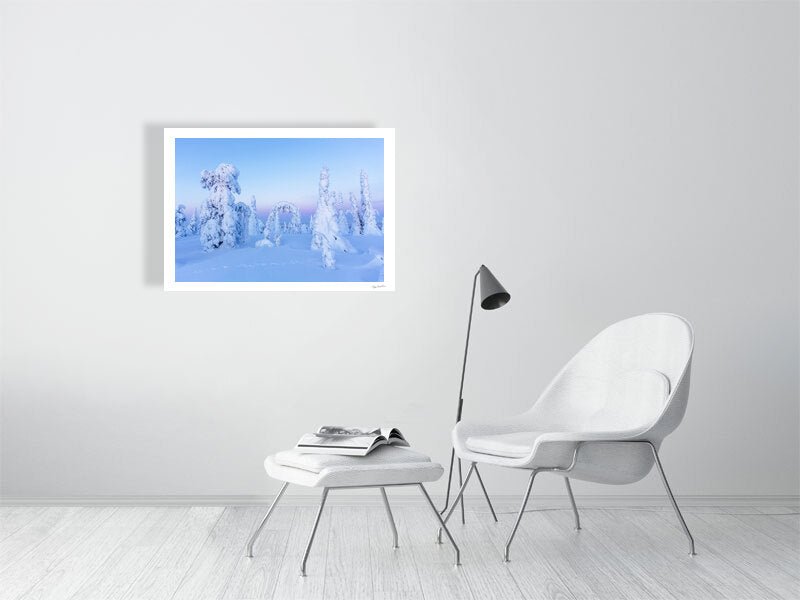 Photo print of snowy fairy-tale trees in pastel Arctic landscape, white living room wall.