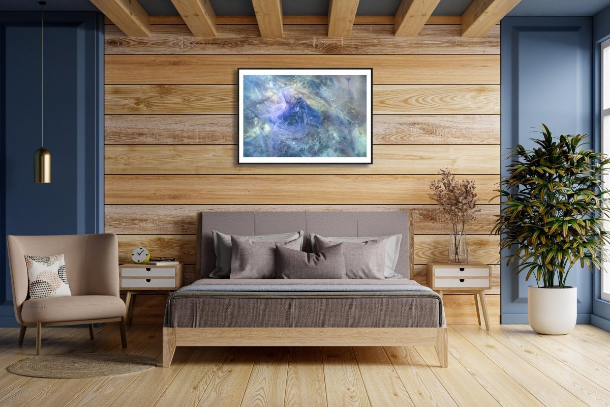 Framed print of Decaying algae lies on the bottom of a lake above a bed in a bedroom.