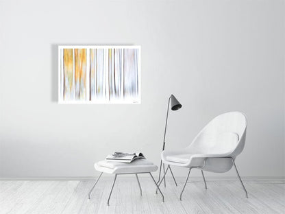 ICM birch forest snowfall print, pastel autumn trees, white living room wall.