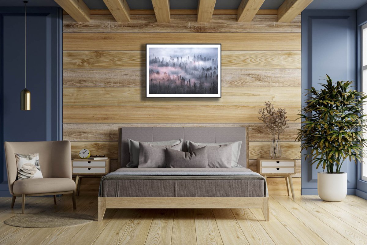 Framed boreal forest fog print, trees disappearing into the mist, wooden wall.