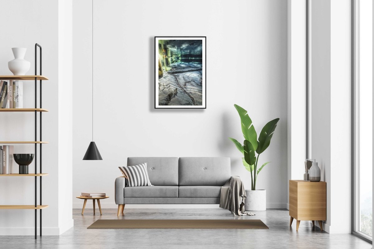 Framed underwater spring photo, white wall, modern living room.