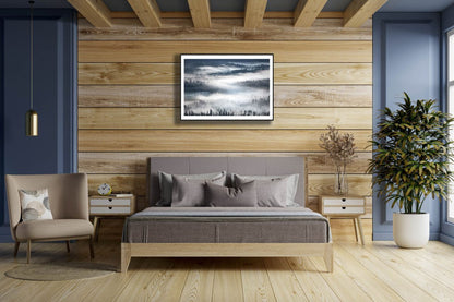 Framed foggy boreal forest photo, tree silhouettes, wooden bedroom wall.