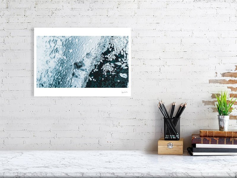 Aerial photo print of cracked Norwegian sea ice, broken fragments floating above the seabed, white living room wall.
