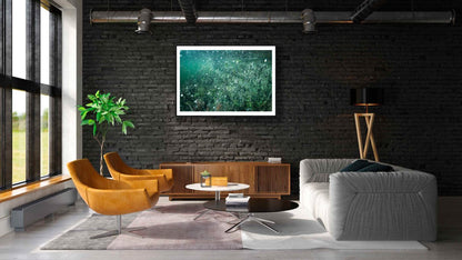 Framed photo of underwater flooded lake with air bubbles, magical atmosphere, black brick living room wall.