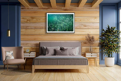 Framed photo of underwater flooded lake with air bubbles, magical atmosphere, wooden bedroom wall.