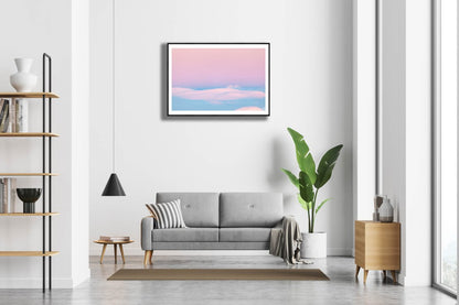 Framed photo of Arctic highland after polar night with pastel tones, white living room wall.