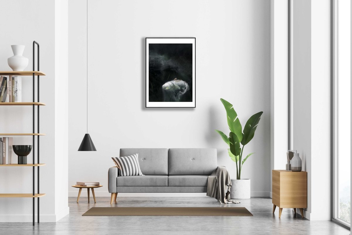 Framed underwater photo of dead perch rising from bottom, hung on white wall above sofa in modern living room.