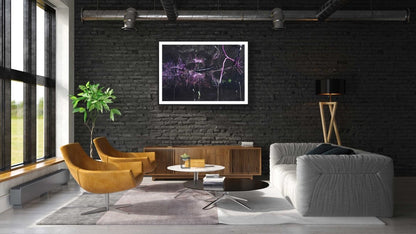 Framed underwater willow roots photo, pink reflection, black brick wall above cabinet in modern living room.