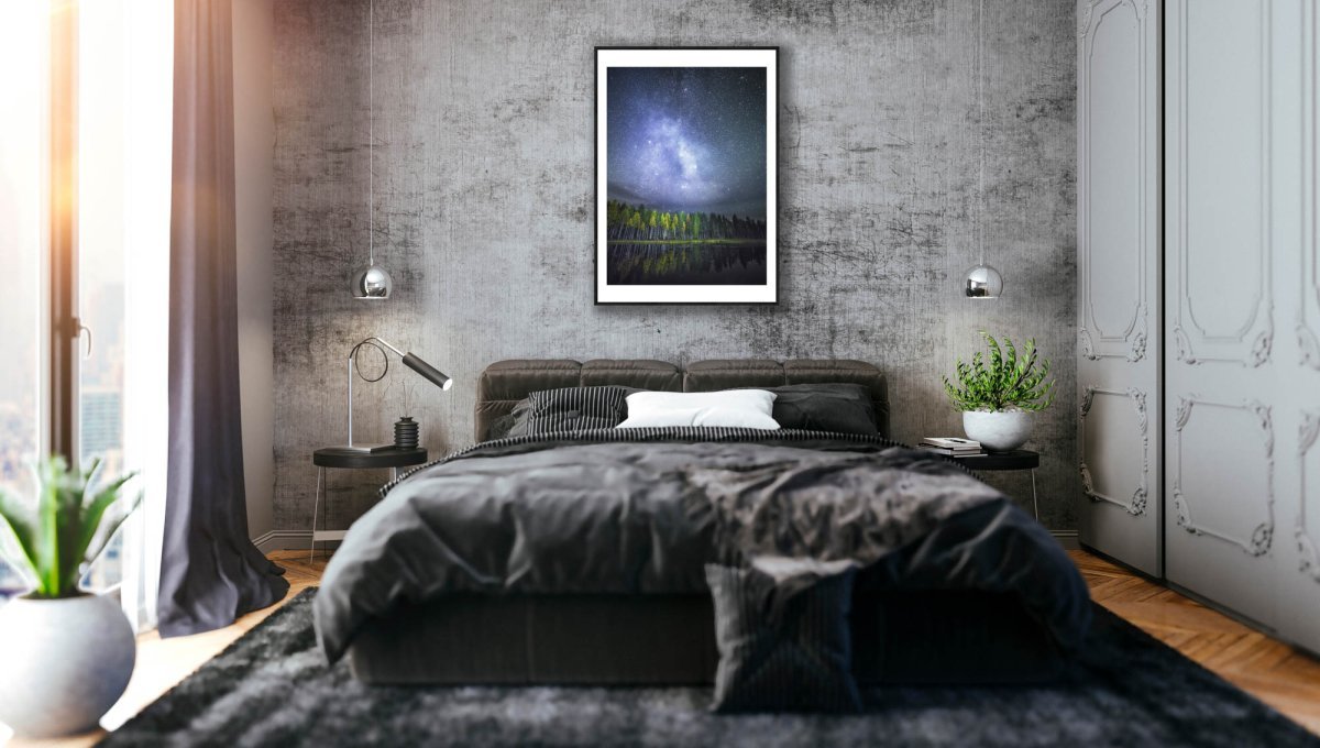 Framed photo of autumn forest reflected on tranquil water, stars and Milky Way visible, stone grey bedroom wall.