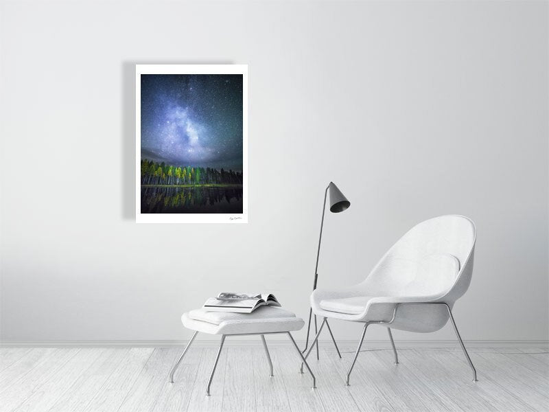 Photo print of autumn forest reflected on tranquil water, stars and Milky Way visible, white living room wall.