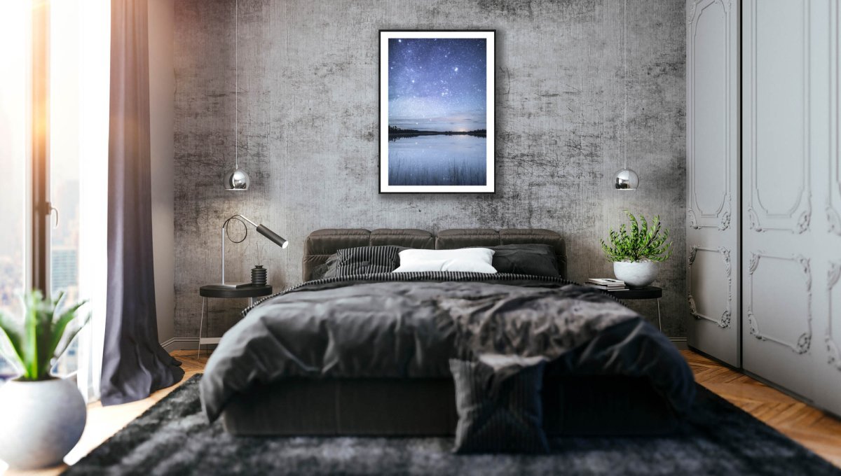 Framed fine art photo of starry night reflected on tranquil lake in northern Finland, stone grey bedroom wall.