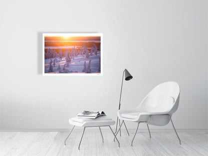 Photo print about snow-covered Riisitunturi, purple sunrise, displayed on white wall.